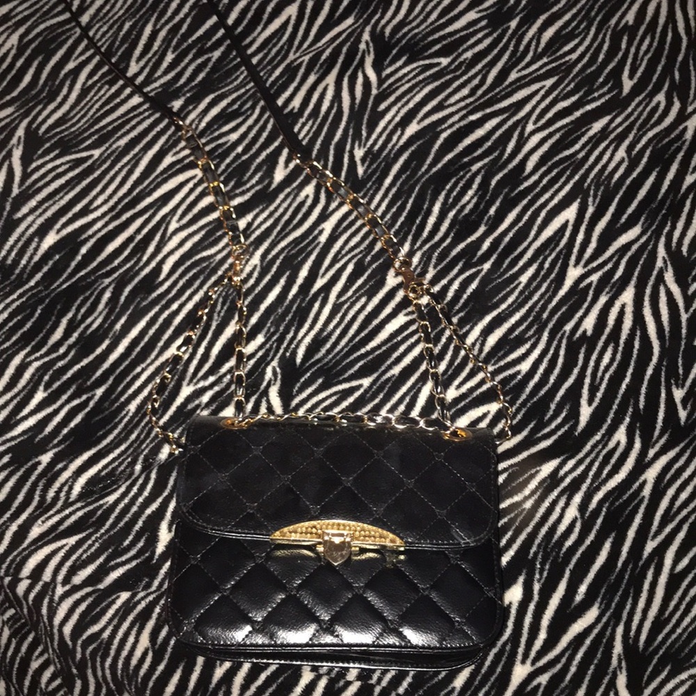A nice leather black purse with gold detailing